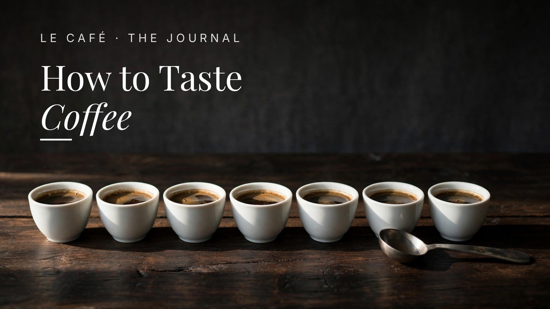 Coffee cups arranged for a tasting, Le Café Journal header: How to Taste Coffee