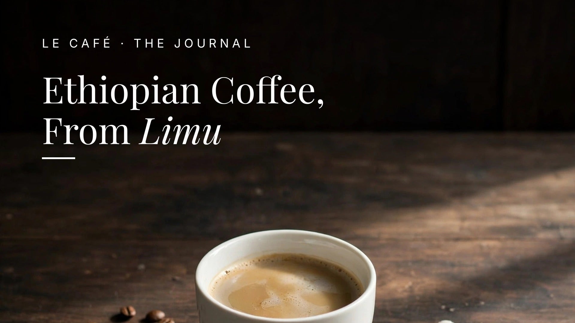 A white cup of light roast coffee on a dark wood table in soft morning light, with whole beans nearby. Le Café Journal header: Ethiopian Coffee, From Limu